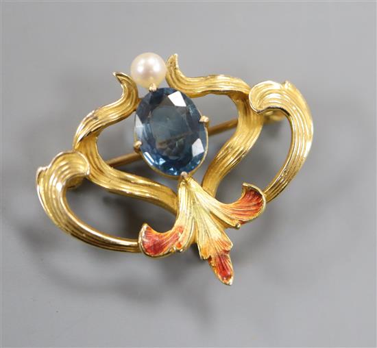 An Art Nouveau yellow metal, sapphire, seed pearl and enamel brooch, 25mm.
